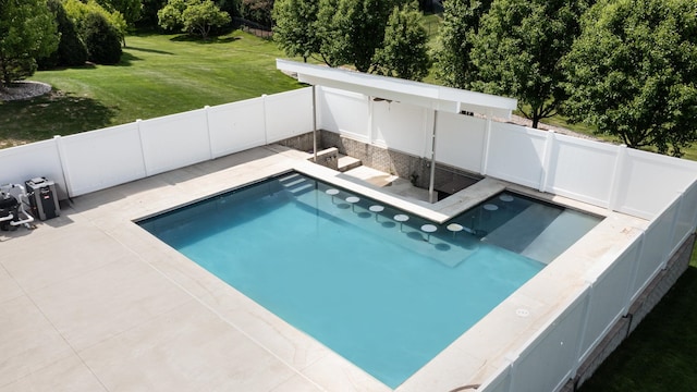 view of pool featuring a lawn