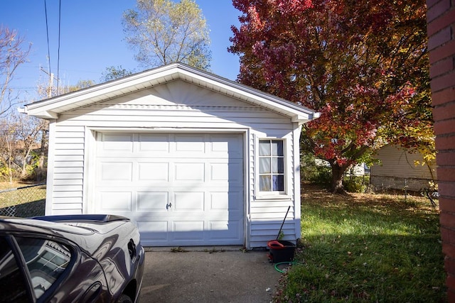 garage with a lawn