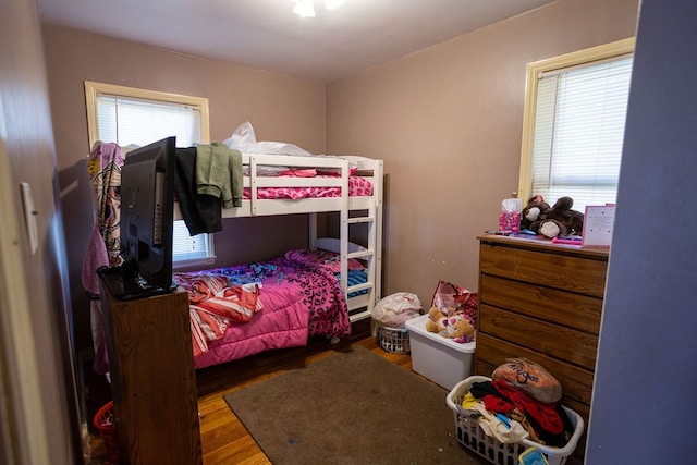 bedroom with wood-type flooring