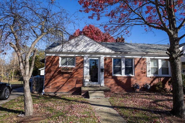 19007 Roscommon St, Harper Woods, MI 48225 - bungalow-style home featuring a chimney and brick siding