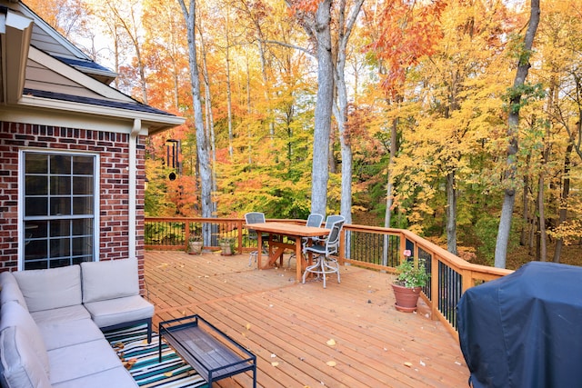 deck with grilling area and an outdoor hangout area