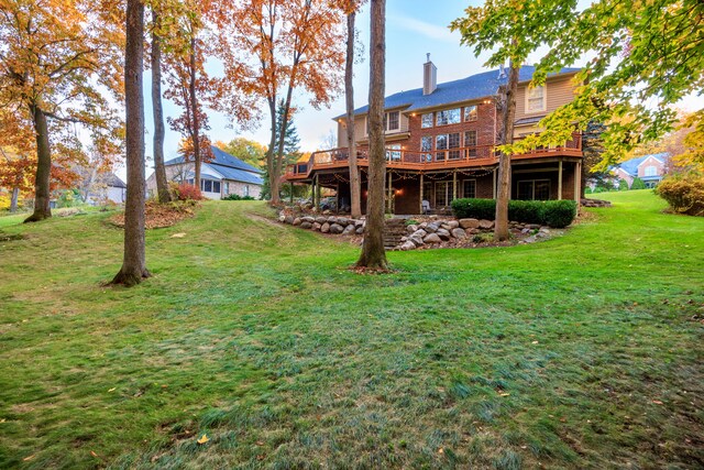 view of yard featuring a wooden deck