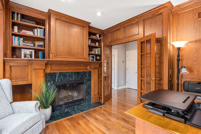 office featuring a fireplace and light hardwood / wood-style floors