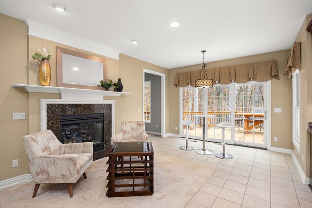 living room featuring ornamental molding and light tile patterned floors