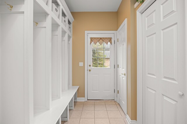 mudroom with light tile patterned floors