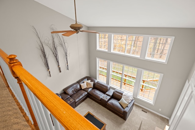 living room featuring carpet floors, high vaulted ceiling, and ceiling fan