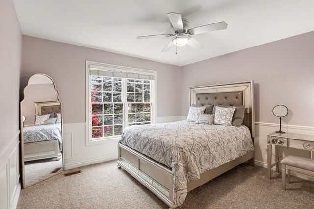 carpeted bedroom featuring ceiling fan