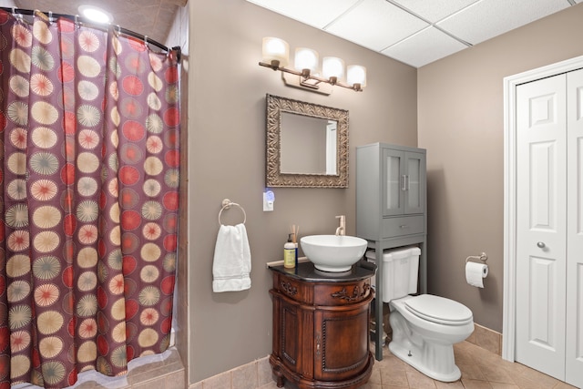 bathroom featuring tile patterned flooring, vanity, toilet, and a shower with shower curtain