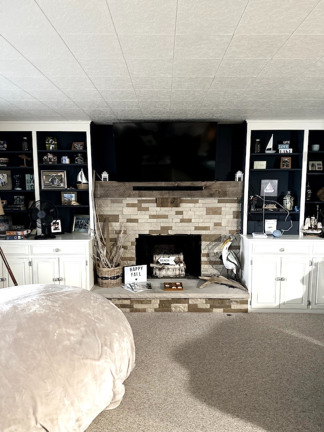 carpeted living room featuring a fireplace