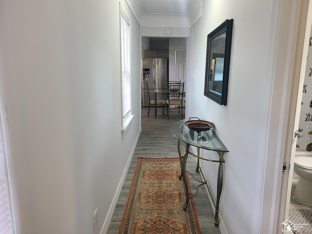 hall with dark wood-type flooring