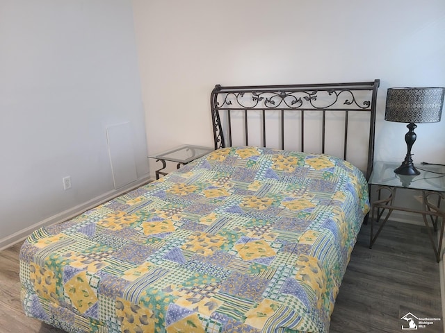 bedroom featuring wood-type flooring