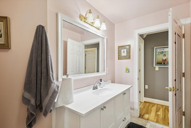 bathroom featuring hardwood / wood-style flooring and vanity