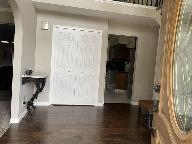 foyer with dark wood-type flooring