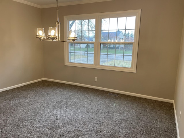 empty room with crown molding, carpet floors, and a notable chandelier