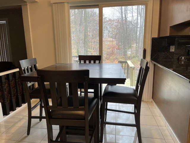 dining area with light tile patterned floors