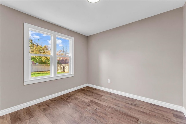 unfurnished room featuring light hardwood / wood-style floors