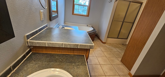 bathroom with tile patterned flooring, vanity, and an enclosed shower