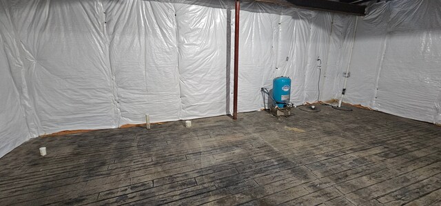 basement featuring dark hardwood / wood-style flooring