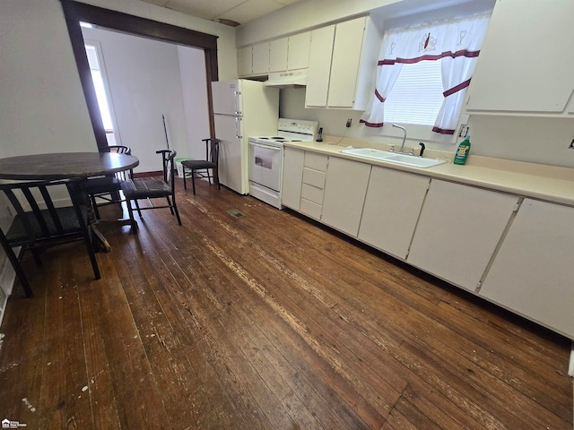 kitchen featuring sink, white cabinets, dark wood-type flooring, and white appliances