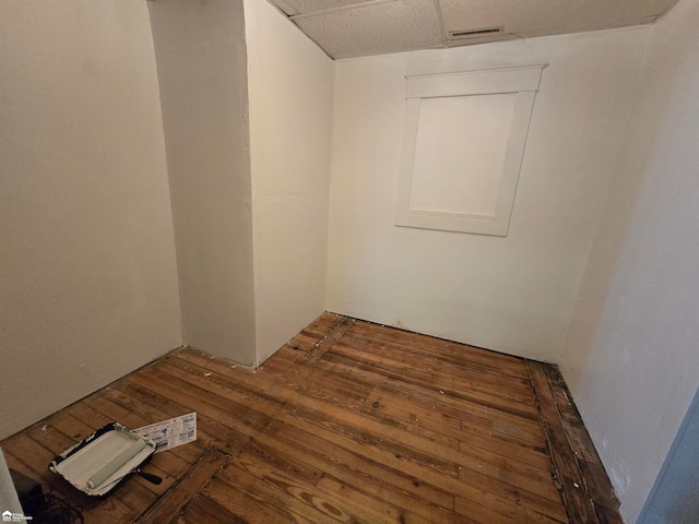 unfurnished room featuring dark wood-type flooring