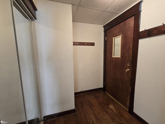 182 W Vienna St, Clio, MI 48420 - hall featuring a paneled ceiling, wood finished floors, and baseboards