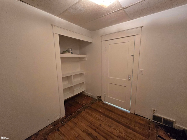 empty room with dark hardwood / wood-style floors