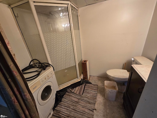 bathroom with toilet, tile patterned flooring, an enclosed shower, and washer / dryer