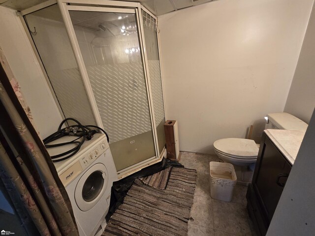 182 W Vienna St, Clio, MI 48420 - bathroom with washer / dryer, toilet, a stall shower, and vanity