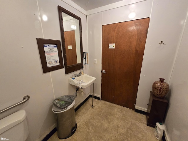 interior space featuring toilet and sink