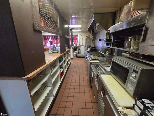 kitchen with dark tile patterned floors