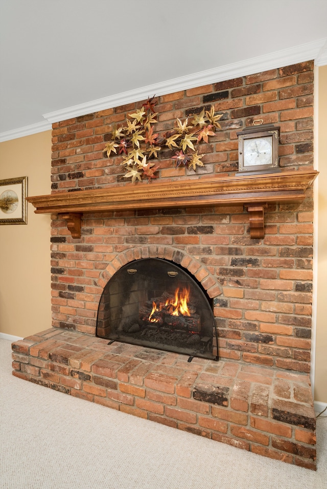 details with carpet flooring, crown molding, and a fireplace