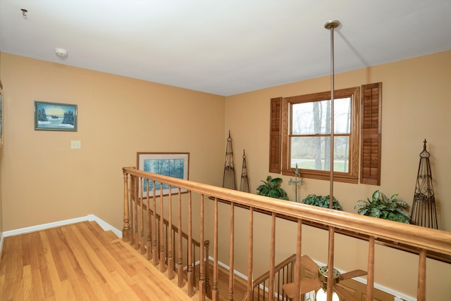 hallway with light hardwood / wood-style floors