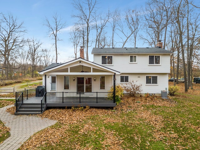 rear view of house with a porch and cooling unit