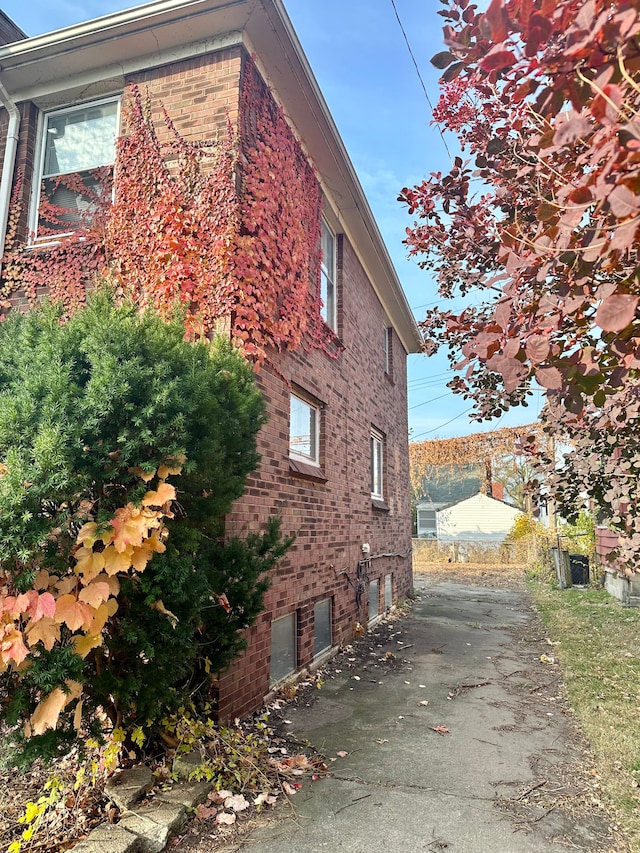 view of side of home with a patio area