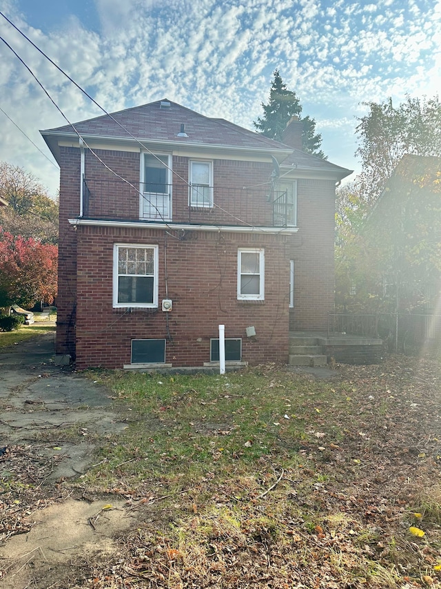 rear view of house with a balcony