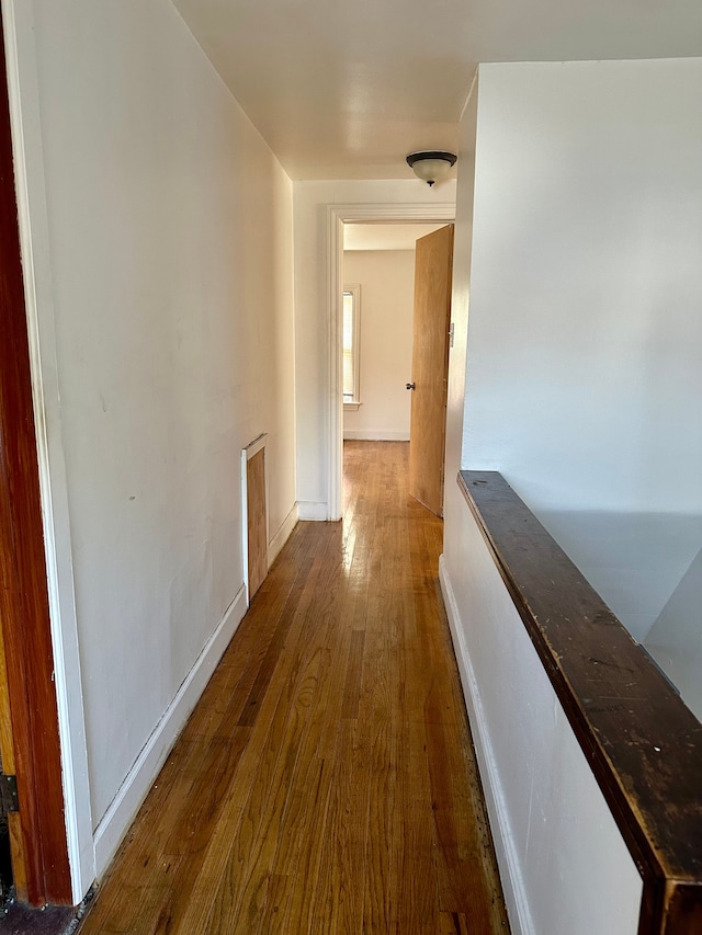 hall featuring dark wood-type flooring