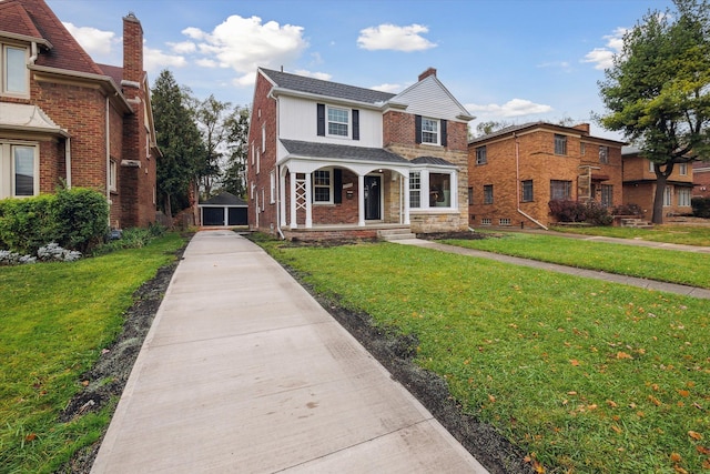 view of front of house featuring covered porch and a front yard