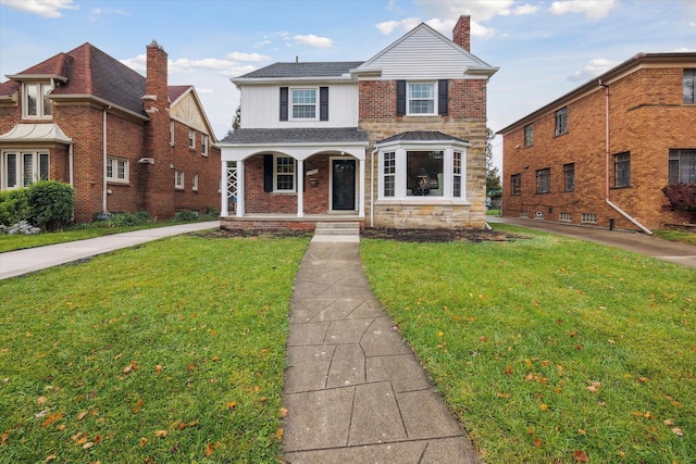 view of front of home with covered porch and a front yard