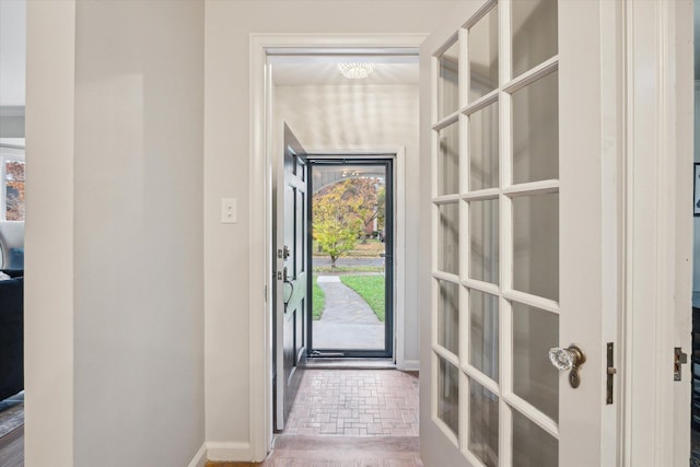 doorway with wood-type flooring and french doors