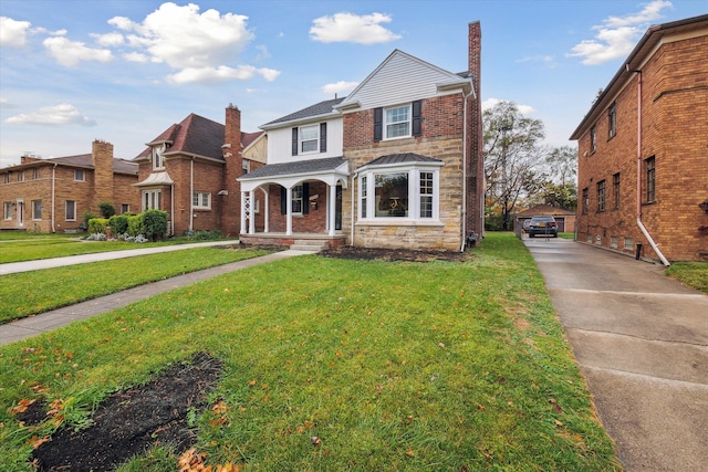 view of front facade with a porch and a front lawn