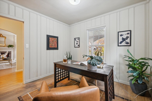 office featuring light hardwood / wood-style flooring and ornamental molding