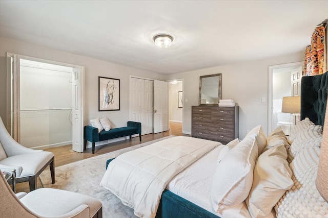 bedroom with light hardwood / wood-style flooring