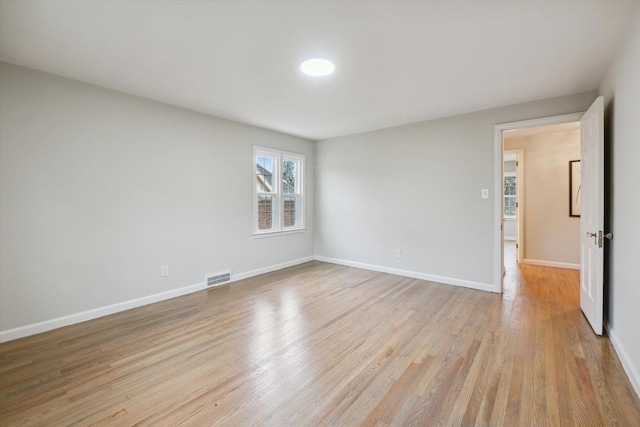 unfurnished room with light hardwood / wood-style floors