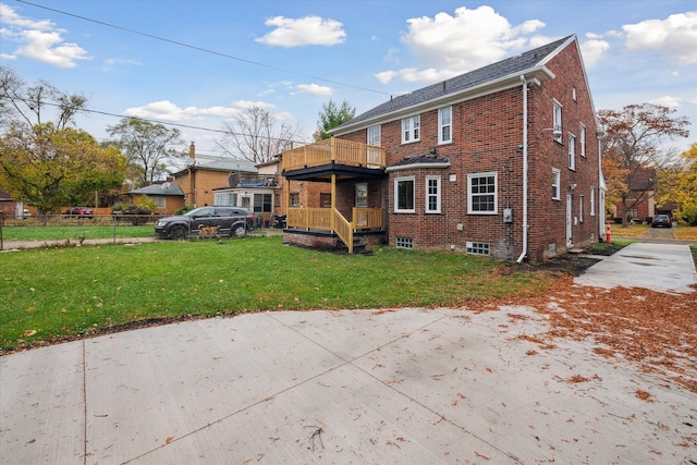 view of front of home featuring a balcony and a front yard