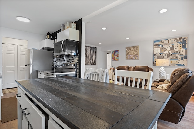 dining area with light hardwood / wood-style flooring