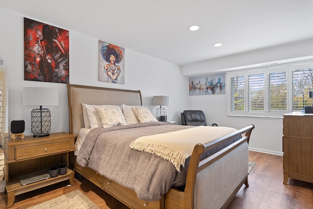 bedroom with hardwood / wood-style floors