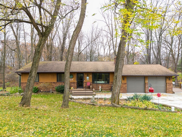 ranch-style home with a garage and a front yard