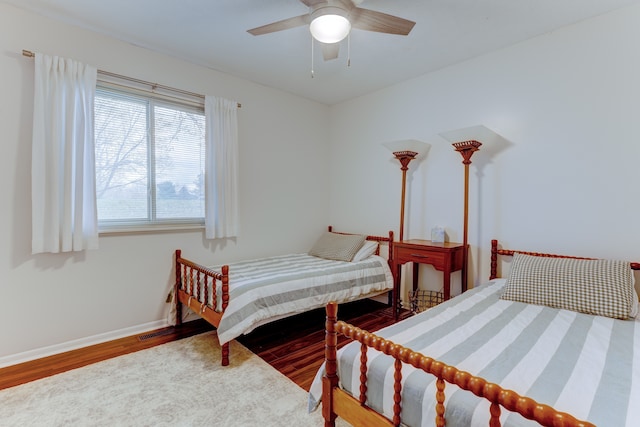 bedroom featuring hardwood / wood-style flooring and ceiling fan