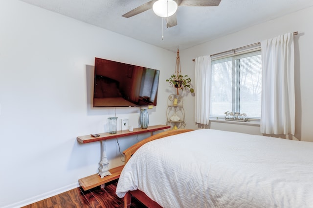 bedroom featuring wood-type flooring and ceiling fan