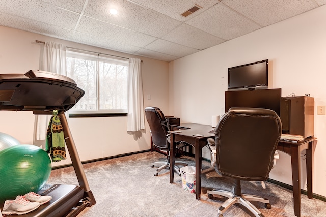 home office with light carpet and a drop ceiling